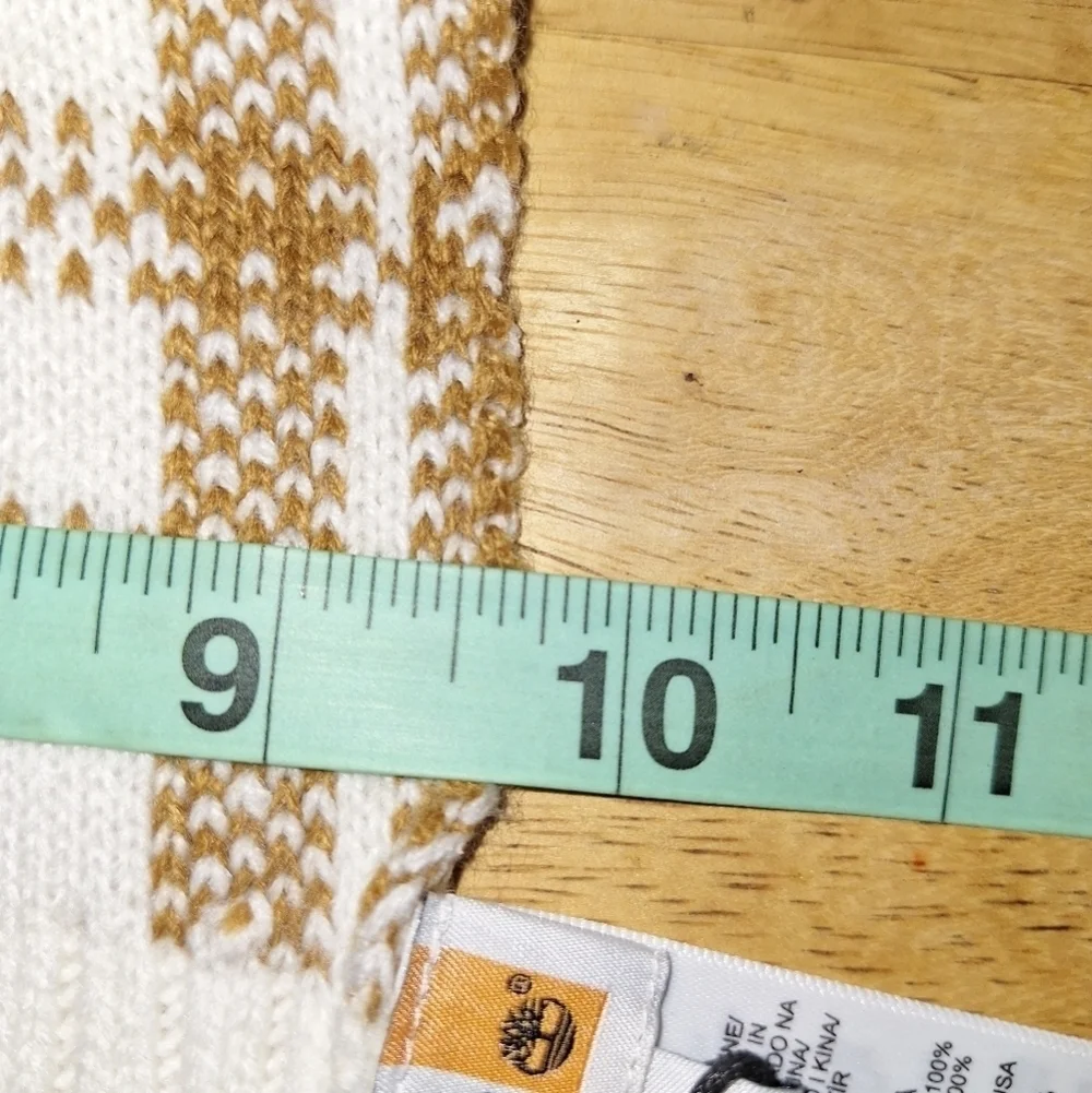 A Timberland white/ lt. brown plaid scarf that's 67